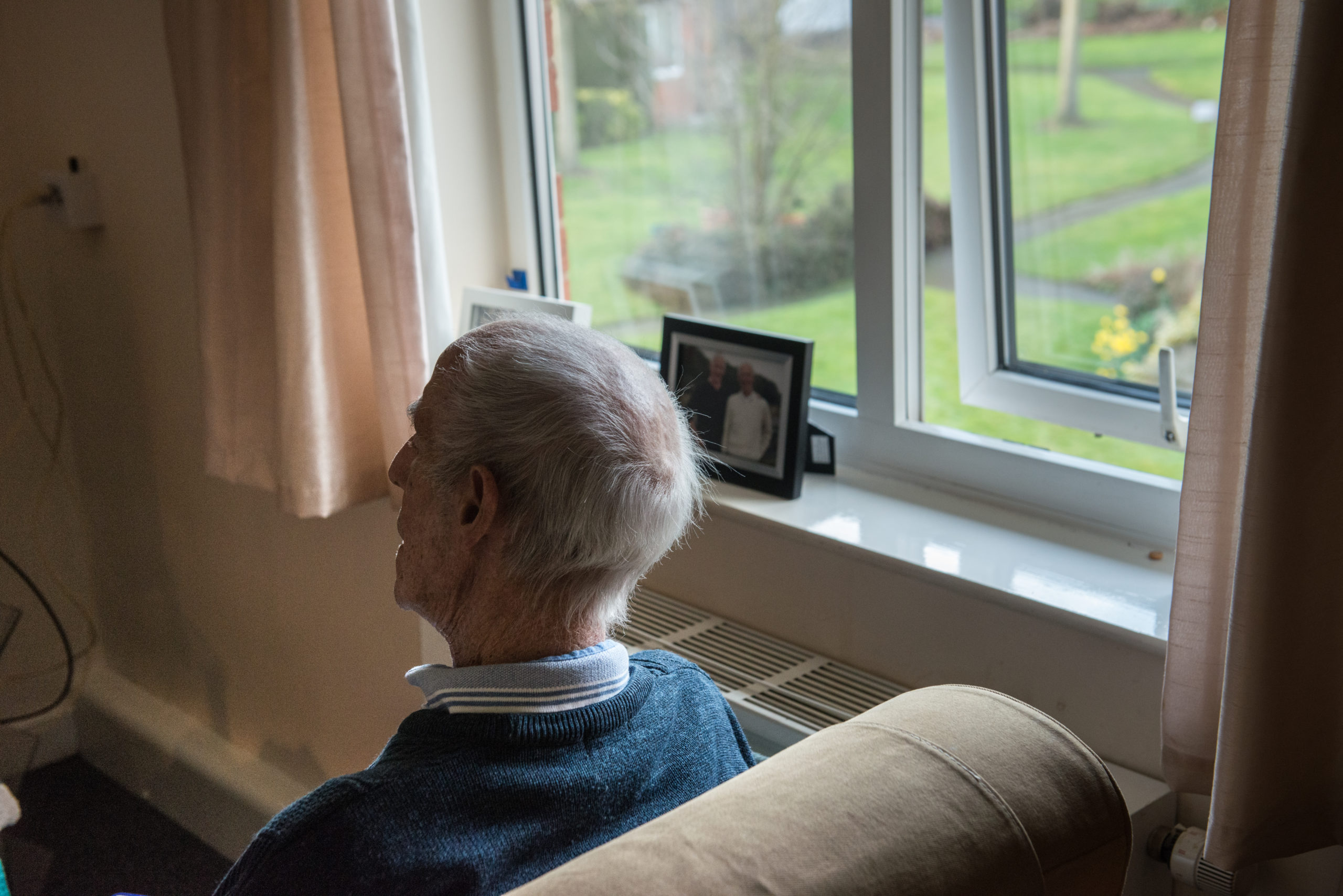 Man sitting on chair facing away